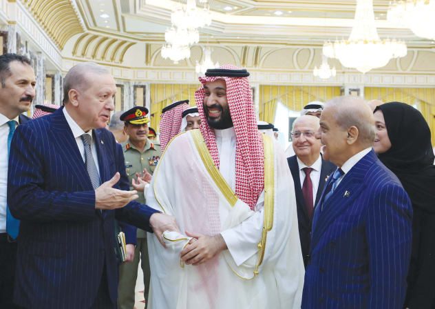 (From L) TURKISH PRESIDENT Recep Tayyip Erdogan, Saudi Crown Prince Mohammed bin Salman, and Pakistan’s Prime Minister Shehbaz Sharif chat after signing a joint defense agreement in Mecca, Saudi Arabia, Aug. 7.
