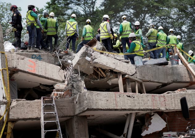 Rescuers work as search and rescue operations are under way at the site of the destroyed Cantabria building, following the earthquake in Cali, Colombia, August 15, 2026.