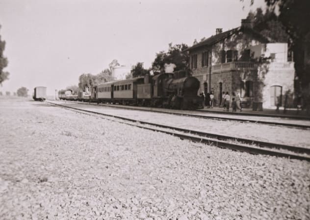 Historic Valley Train at Kfar Yehoshua Station, 1930s. People exit the waiting room where the art gallery is now housed.