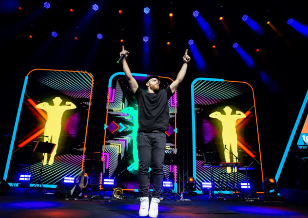 DJ Raphi on stage at his USA Hype Tour in March this year. His shows include interactive, family-friendly live dance and. music performances.