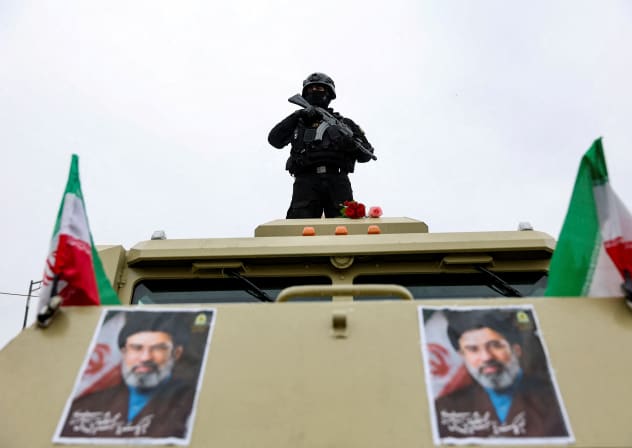 A security personnel stands guard as Iranians take part in a protest marking the annual al-Quds Day, on the last Friday of the holy month of Ramadan, in Tehran, Iran, March 13, 2026
