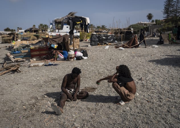 Migrants are seen in an improvised shanty camp in El Trampolin Beach on August 14, 2026 in Ceuta, Spain. Fears of a second surge of migrant crossings into the Spanish North African exclave of Ceuta have intensified following anonymous social media calls claiming that the border will open.