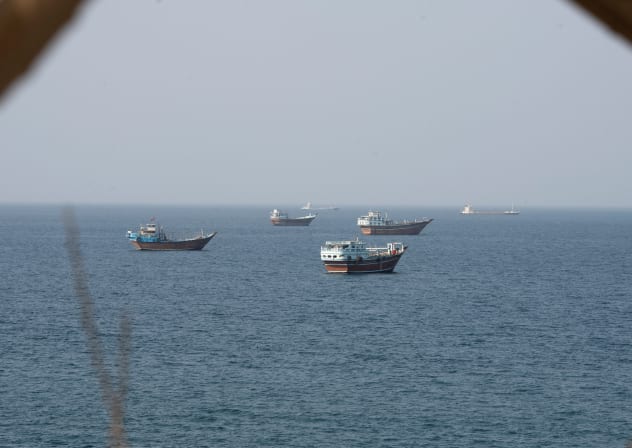 Vessels near the Strait of Hormuz, as seen from Musandam, Oman, August 17, 2026. 