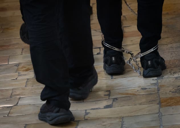 Illustration of arrested suspects on their way to hearing at a District Court.