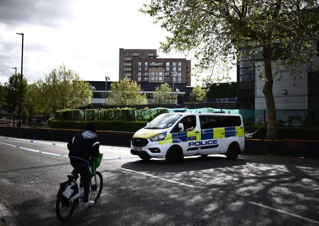 A Police van is parked outside of a warehouse park housing offices of a the Persian-language TV station, Iran International, in Wembley, northwest London on April 16, 2026.