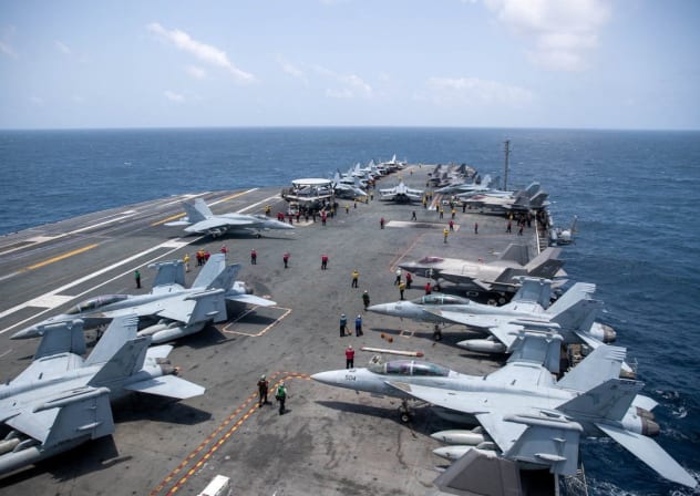 US Navy sailors work on the flight deck of the aircraft carrier USS George Washington as it transits the Arabian Sea to support US military operations in the war with Iran August 20, 2026.