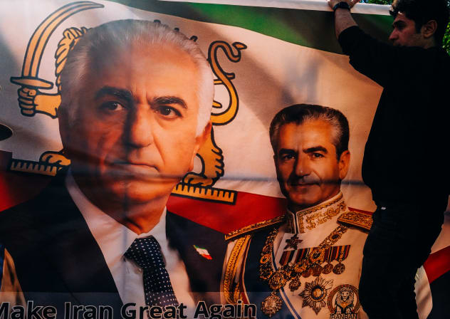 A SUPPORTER holds a banner depicting Reza Pahlavi alongside his father, former shah Mohammad Reza Pahlavi. The Islamic Republic’s recent media campaign has repeatedly sought to undermine the exiled prince’s appeal and portray him as incapable of uniting Iran’s opposition.