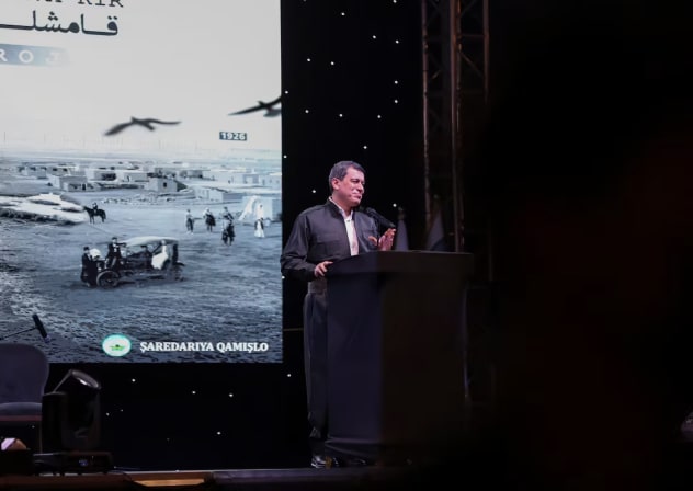 SDF commander Mazloum Abdi delivers a speech during a celebration marking the centenary of the city of Qamishli, Syria, August 20, 2026.