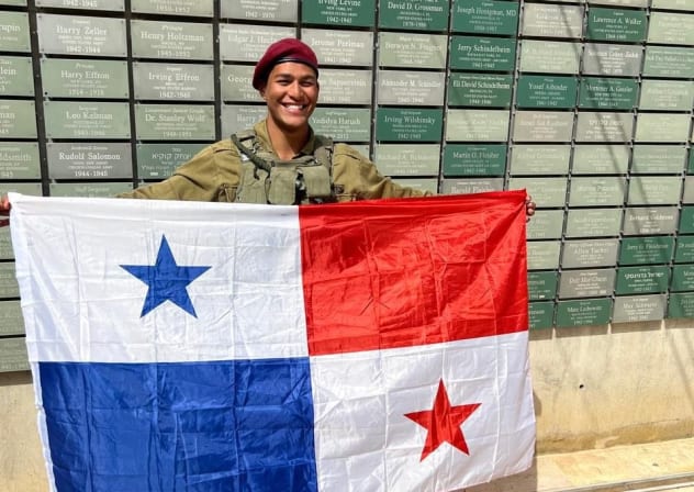 Ofir Levy with the Panamanian flag during his ‘masa kumta,’ the final march marking the completion of combat training in the IDF. 