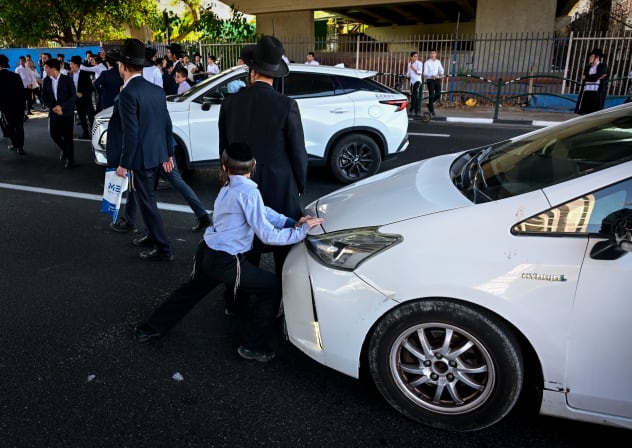 Ultra orthodox Jews clash with police during a protest against the drafting of ultra orthodox jews to the Israeli army, on road 4 near Bnei Brak, August 08, 2026.