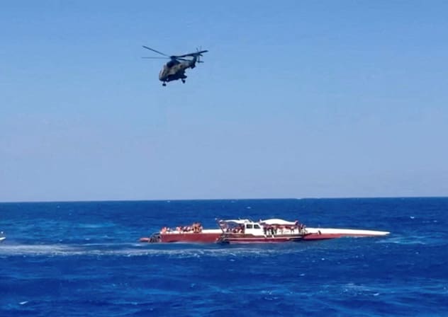 A helicopter flies during a rescue operation after a ferry that capsized off the coast of Northern Cyprus, August 30, 2026, in this screengrab taken from a video.