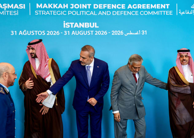 Turkey's Foreign Minister Hakan Fidan, Pakistan's Deputy Prime Minister and Foreign Minister Mohammad Ishaq Dar, and Saudi Arabia's Foreign Minister Prince Faisal bin Farhan Al Saud prepare to pose for a picture before the first committee meeting under the Mecca Joint Defense Agreement.