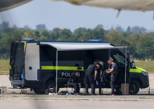 (Illustrative) Police officers work in the vicinity of an Antonov cargo plane, near which a drone was found, at Leipzig/Halle Airport in Schkeuditz, Germany, August 5, 2026, after the police said explosives experts examined a drone near a runway.