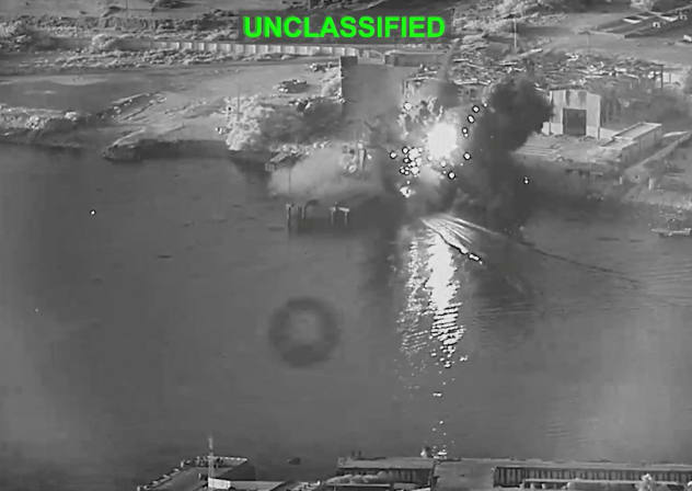 Smoke rises after a U.S. one-way attack surface drone reached its target, a submarine and ship maintenance facility according to U.S. Central Command, in Bandar Abbas, Iran, in this screengrab taken from a video, which was released July 13, 2026. 
