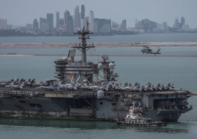 The US Navy Nimitz-class aircraft carrier USS Abraham Lincoln sails toward Laem Chabang Port before docking for a rest stop following a long deployment in the Middle East, with the Pattaya skyline in backdrop, in Chonburi province, Thailand, September 2, 2026.