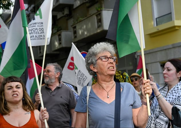Demonstrators wave Palestinian flags and chant against Israel’s and America’s war with Iran in front of the Israeli embassy in Portugal in May. 