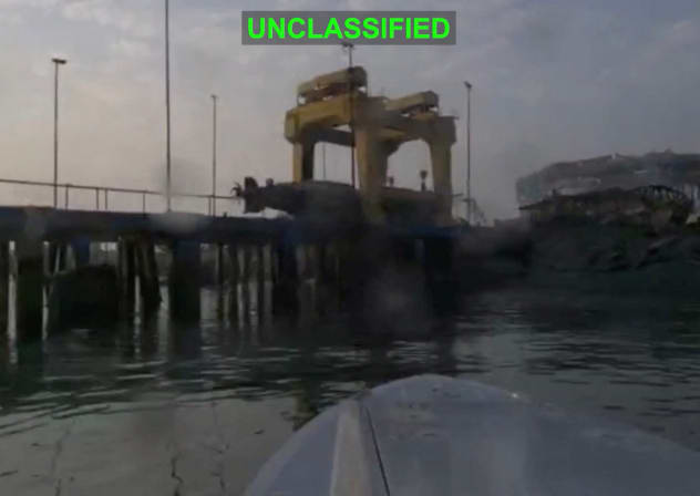 A US one-way attack surface drone approaches its target, a submarine and ship maintenance facility according to US Central Command, in Bandar Abbas, Iran, in this screengrab taken from a video, which was released July 13, 2026. 