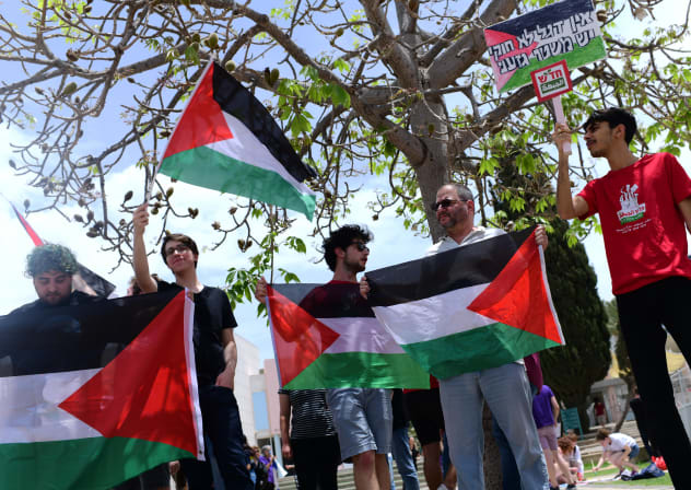 Israeli-Arab students and activists protest against a bill that would ban waving Palestinian flags at Israeli universities, at the Tel Aviv University, May 28, 2023. 