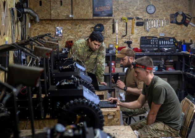 Soldiers of NC13, a unit of Ukraine’s Third Army Corps that specializes in the combat use of unmanned ground vehicles (UGV), prepare new vehicles for field use in a workshop in the Kharkiv region, Ukraine May 22, 2026.