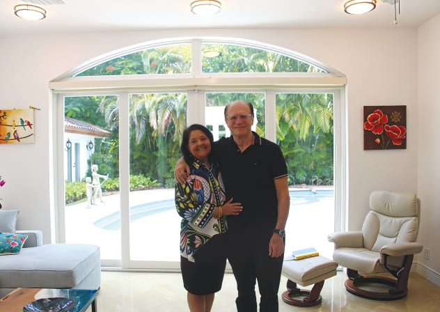 GENIE AND Michael Milgrom pose in their home in Miami.