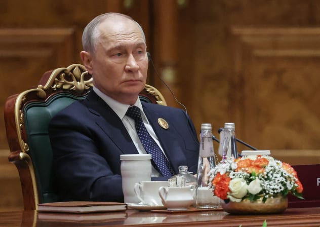 In this pool photograph distributed by the Russian state agency Sputnik, Russia's President Vladimir Putin attends the 18th BRICS Summit in New Delhi on September 12, 2026.