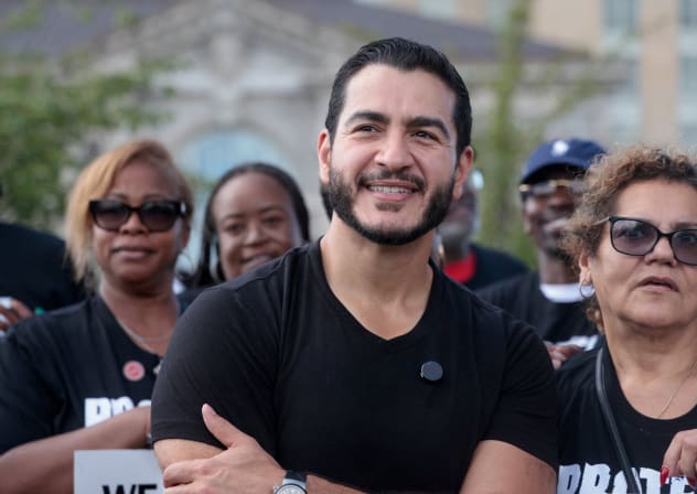 Democratic candidate for US Senate Abdul El-Sayed poses with union members from UAW Local 51 during the Labor Day Parade in Detroit, Michigan, US, September 7, 2026.