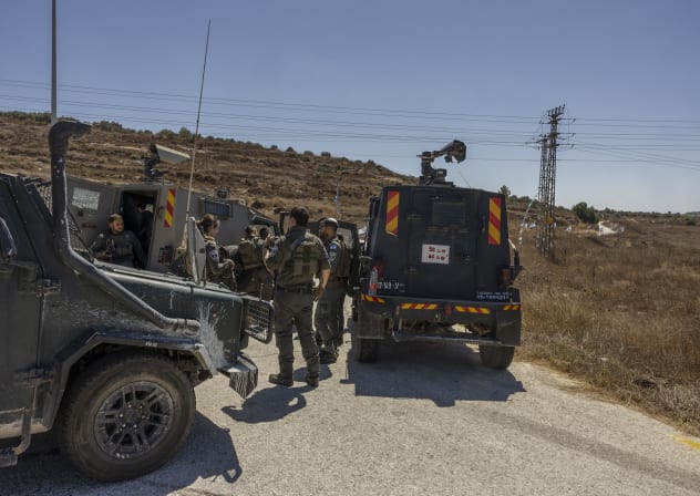 Israeli soldiers and police officers near the scene of a shooting attack at a spring near the Israeli settlement of Neve Tzuf in the West Bank, where an Israeli man was shot by a Palestinian terrorist and later died of his wounds, September 20, 2026.