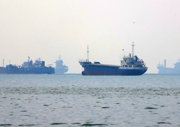 Vessels transit the Hormuz Strait off the coast of Iran's southern port city of Bandar Abbas on September 7, 2026.