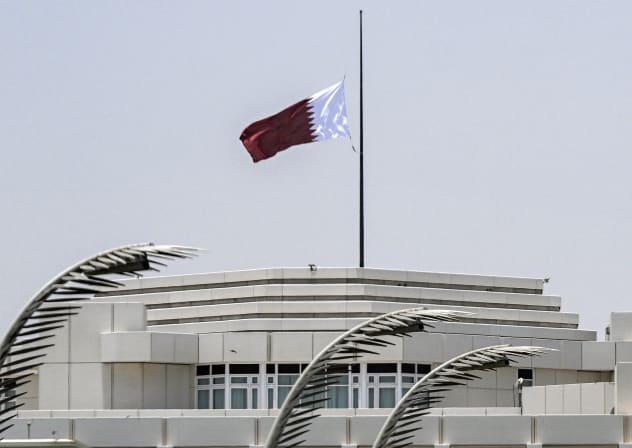 Qatar's flag flies at half-mast above the Amiri Diwan headquarters in Doha on July 12, 2026 following the announcement of the death of the state's former emir, Sheikh Hamad bin Khalifa Al-Thani who led the country from 1995 to 2013; Illustrative.