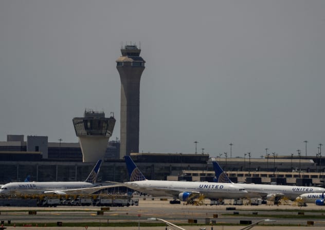 The control tower is pictured as planes are seen on the tarmac after an air traffic control outage, bringing flights to a standstill at Newark International Airport in Newark, New Jersey, US, May 11, 2025.