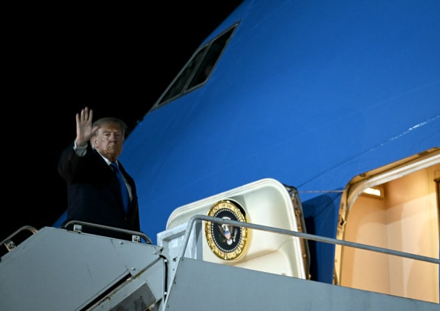 US President Donald Trump waves while boarding Air Force One at John F. Kennedy International Airport in New York on September 22, 2026.