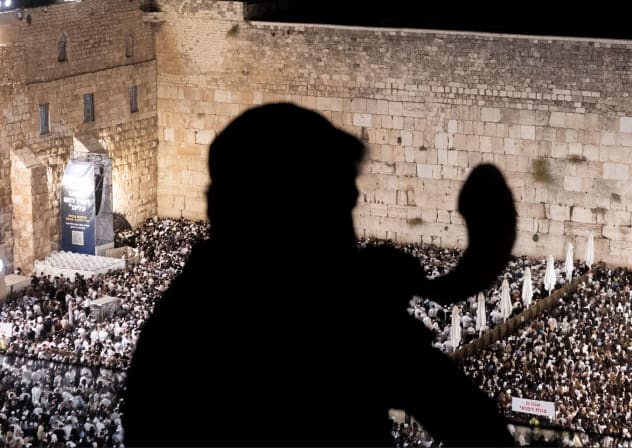 A rabbi blows a shoat ahead of Yom Kippur at the Western Wall in Jerusalem in 2026.