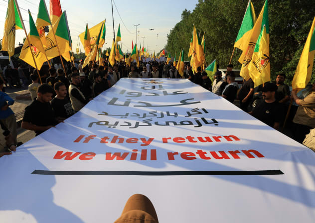 Supporters of a Shi'ite armed group celebrate the withdrawal of US-led coalition forces from Iraq, ending a military presence that began after the 2003 US-led invasion, in Baghdad, Iraq, September 30, 2026.