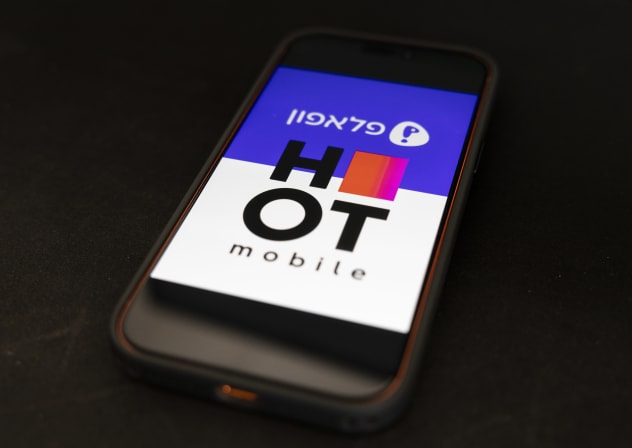 An illustration showing the logos of Pelephone and Hot Mobile displayed on a Pelephone screen in Jerusalem, November 17, 2025.