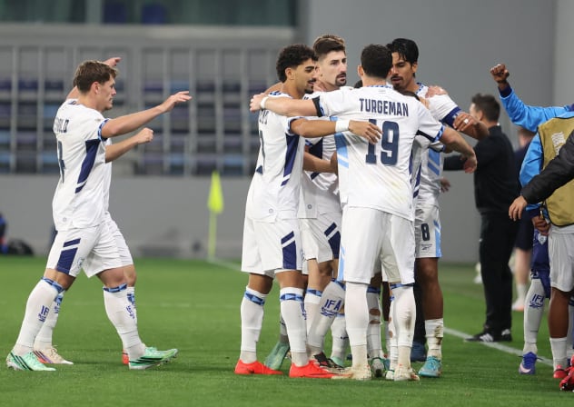 ISRAEL'S DOR PERETZ celebrates with teammates after scoring the blue-and-white’s lone goal in a 1-1 Nations League draw with Ireland in Backa Topola, Serbia.