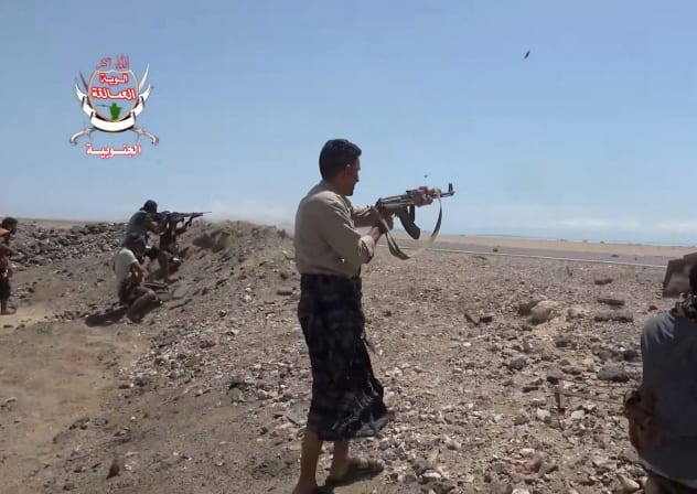 Pro-Saudi-backed Yemeni government fighters fire their weapons during what government forces say was an advance against the Iran-backed Houthis, near Dhubab, Taiz Governorate, Yemen, October 5, 2026.
