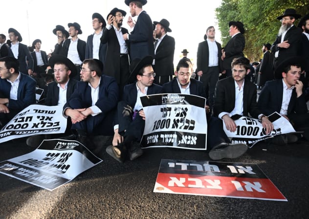 Haredi (ultra-Orthodox) protesters block traffic on Highway 4 during anti-draft demonstration, October 8, 2026.