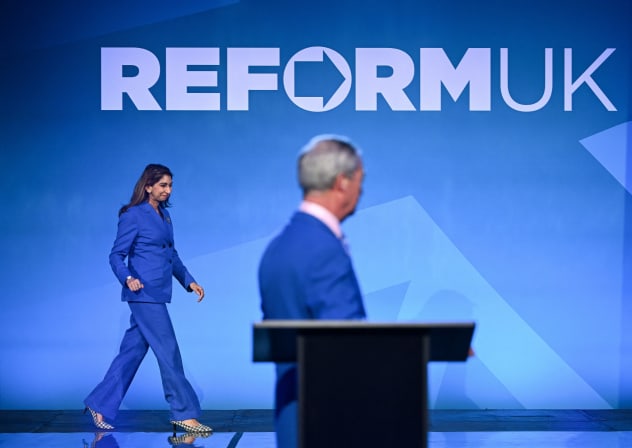 Suella Braverman walks on the stage as she is being announced by Britain's Reform UK leader Nigel Farage as the party's Shadow Education and Skills Secretary, in London, Britain, February 17, 2026