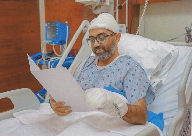 Captain Smit Machchhar reads a letter from President Isaac Herzog in the hospital, October 10, 2026.
