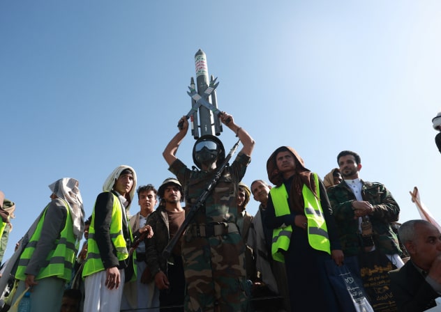 A Houthi supporter wearing a military uniform holds a mock missile as he joins Houthi supporters in a rally to show support to the movement as fighting intensifies across several Yemeni fronts, in Sana'a, Yemen, October 9, 2026