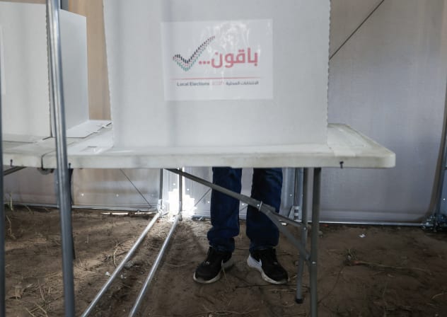 A Palestinian man casts his ballot at a polling station during municipal elections in Deir el-Balah, Gaza Strip, on April 25, 2026. (Illustrative)