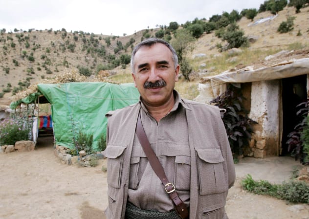 Murat Karayilan co-leader of the Kurdistan Worker's Party (PKK) and leader of the Kurdistan Democratic Confederalism Council (KKK) poses during an interview with AFP in a camp near Arbil in the Sinena mountains, northern Iraq, 11 August 2005.