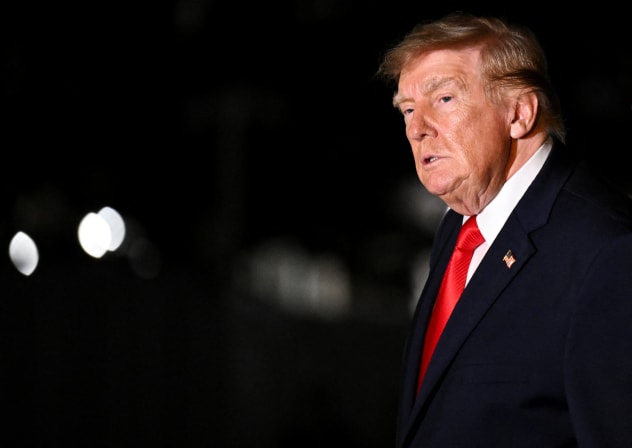 US President Donald Trump looks on while walking as he returns to the White House after travelling to Ohio, in Washington, DC, US, October 12, 2026
