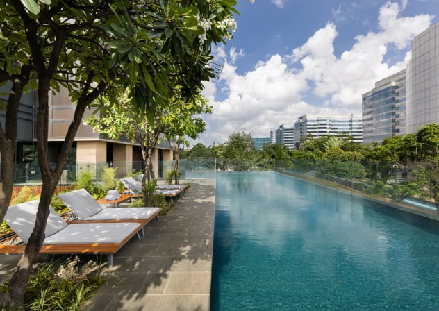 The outdoor swimming pool at The Den Bengaluru in Bengaluru, India.