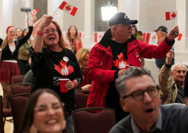 Supporters of the Forever Canadian group, who want Alberta to remain in Canada, wave Canadian flags as they watch the results of a non-binding referendum on Alberta sovereignty in Edmonton, Alberta, Canada October 19, 2026.