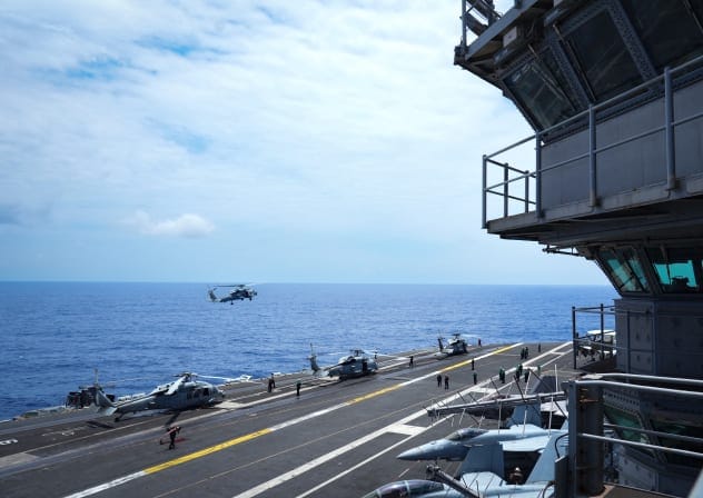 An MH-60 Seahawk helicopter approaches for landing on the aircraft carrier USS Theodore Roosevelt (CVN 71) while underway in the Pacific Ocean near Hawaii, during Exercise RIMPAC (Rim of the Pacific) 2026 on July 17, 2026; illustrative.