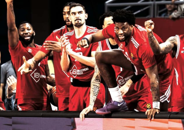 Hapoel Tel Aviv players celebrate on the bench during their 90-81 comeback Euroleague victory over Virtus Bologna in Bulgaria.