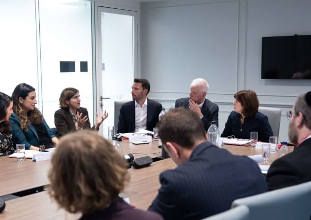 UK Education Secretary Lucy Powell (at the head of the table) and Sir David Bell (to her right) meet with education leaders and members of the Jewish community to discuss the government's response to Bell's review on tackling antisemitism in schools and colleges. October 21, 2026.