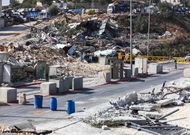 A view of the scene of a deadly shooting attack at the Yehuda Junction checkpoint near the West Bank city of Hebron, where two Israeli soldiers were murdered and three others wounded by Palestinian gunmen the previous day, October 24, 2026.