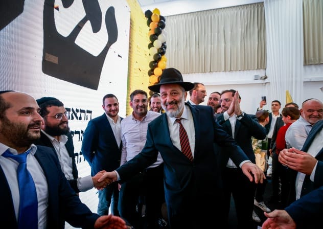Shas party head Arye Deri speaks to supporters as the results of the Israeli elections are announced, in Jerusalem, November 1, 2022